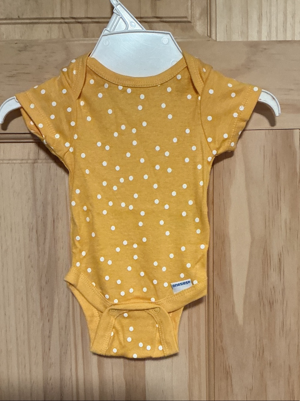 Yellow Polka Dot Baby One-Piece Bodysuit by Onesies®